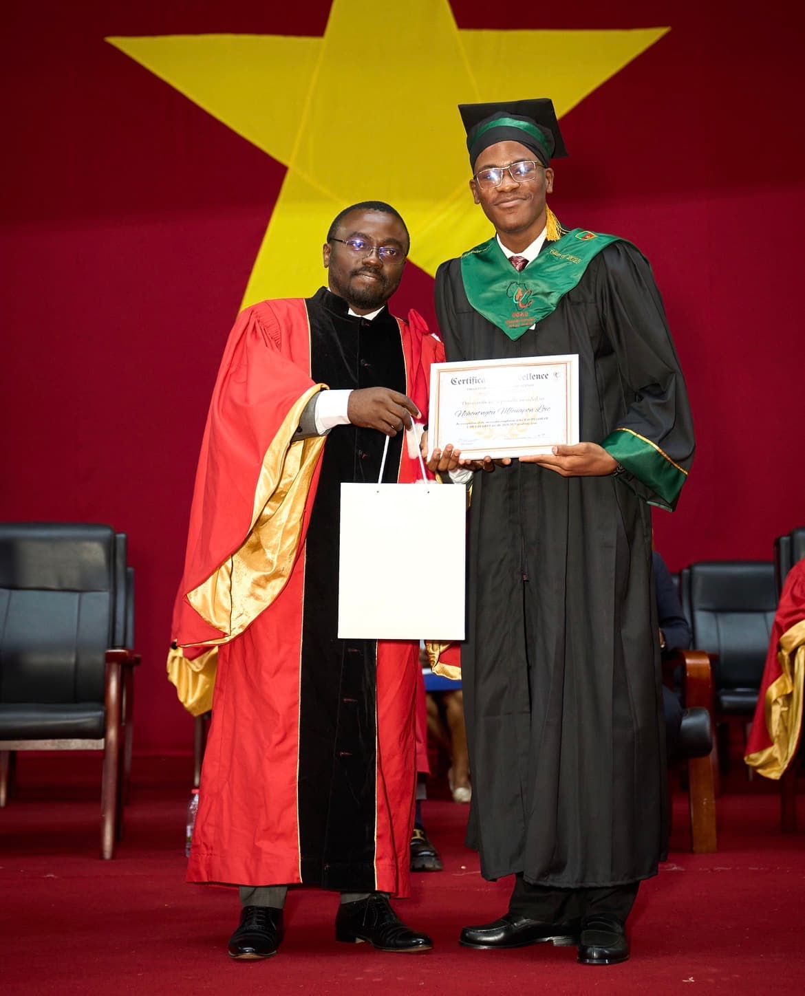 Charles Mfouapon receiving the Certificate of Excellence at UCAC